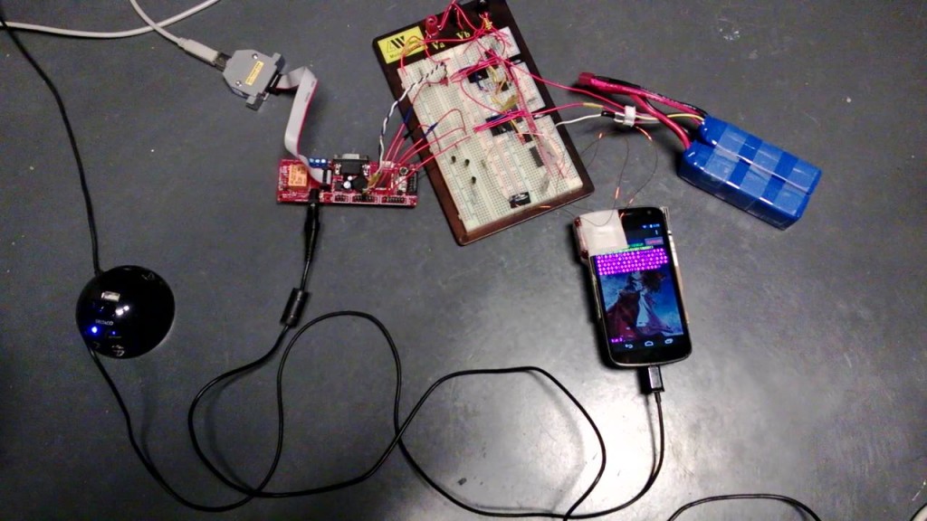 Photograph of the Pulse system. Note that 2 solenoids are attached to the top and the side of the phone using adhesive tape.